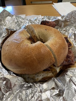 Whole wheat bagel, lightly toasted, with a couple of eggs, turkey bacon, cheese, pepper, and ketchup.