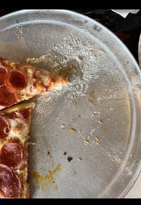 The staff Alex and girl in red purposely added a huge amount of flour under and on top of the children's pizza