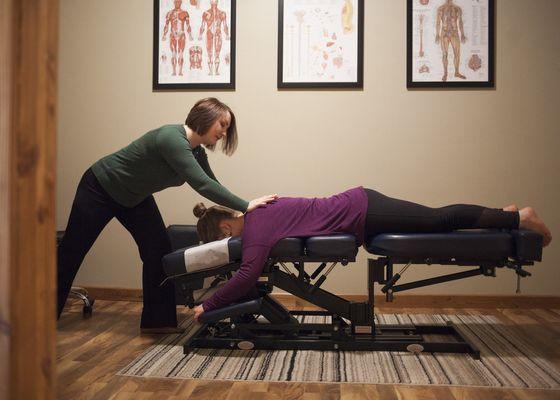 Spinal Adjustment of the upper thoracic spine and shoulder via use of a drop table. Painless & feels great moving vertebrae back in place!