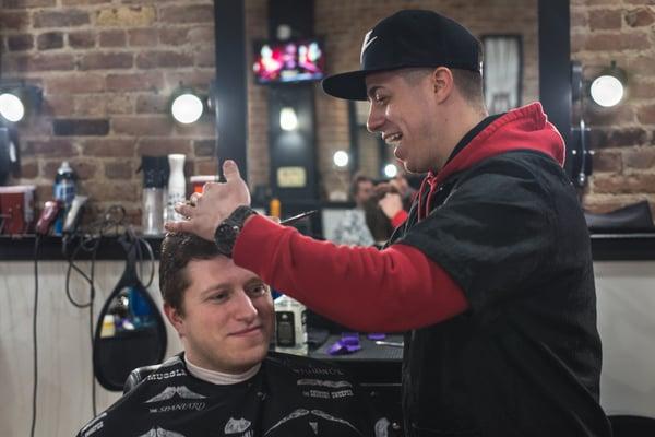 Randy getting a haircut from Dameon.