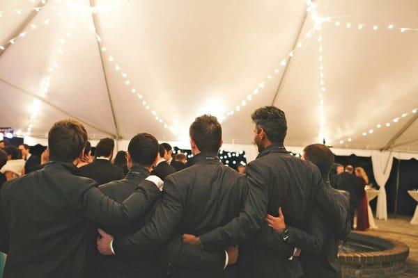 Wedding party Gents in their PROPERSUIT with monogrammed initials under collar.