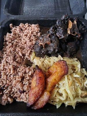 Oxtails, rice and peas w/ cabbage.