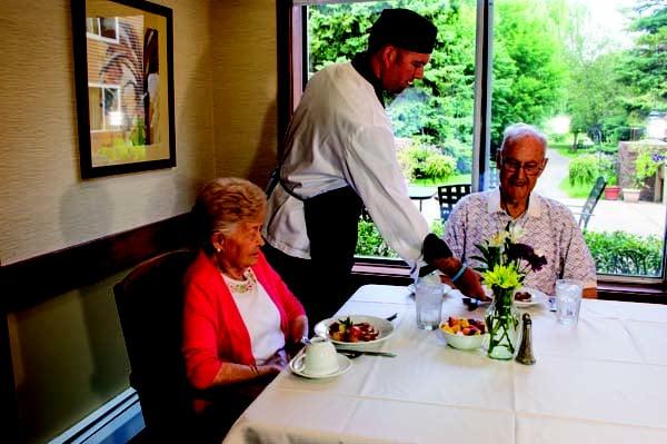 Two residents taking advantage of the restaurant style dining services at Brightondale Senior Campus in New Brighton, MN.