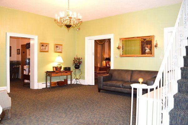 As you enter our funeral home, you are greeted by an open room where the register book and prayer cards are placed. This is a place