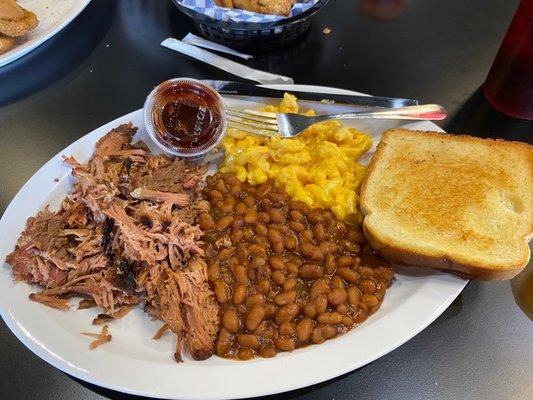 Pulled pork plate with Mac & cheese & baked beans!! The pork was so tender & tasty. You didn't even need the BBQ sauce.