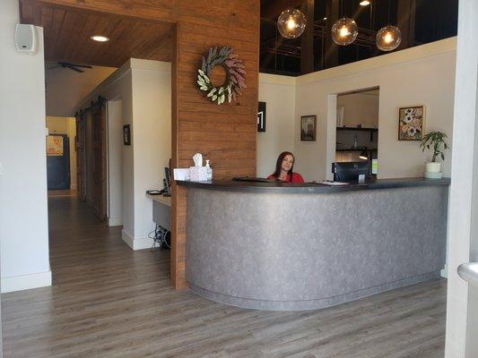 Front desk and a smiling Renee