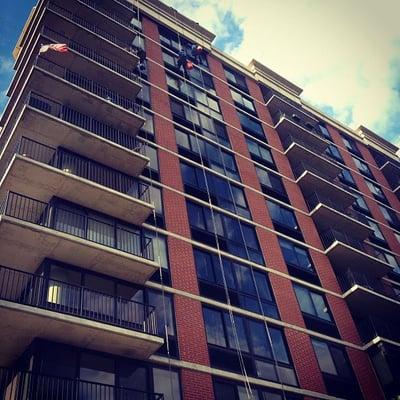 VIP Special Services Window Cleaners rappelling via boatswains chairs on a mid-rise in Jersey City, NJ.