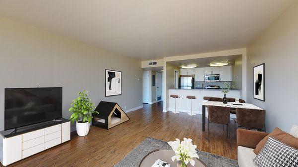 Staged living and dining area featuring hardwood-style vinyl floors.