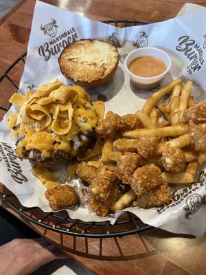 Hamburger, bison chili, Fritos, sauce.  Fries, tators, onion rings so good!