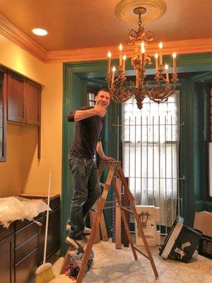 Installed this antique wood chandelier.