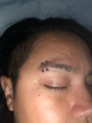 Double eyebrow piercing