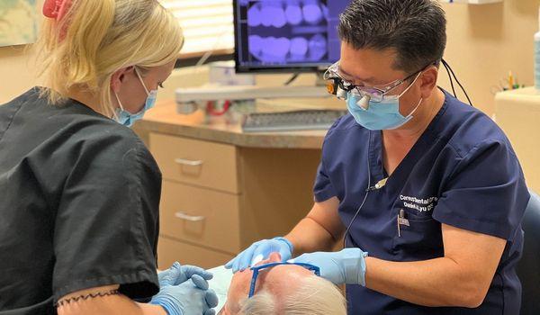 Tempe dentist Dr. Daniel Lyu with smile makeover patient at Cereus Dental Care