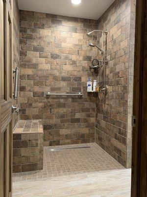 Handicap Curb-less shower with lineal drain. 
Subway tiles, Schluter shower pan and bench systems.