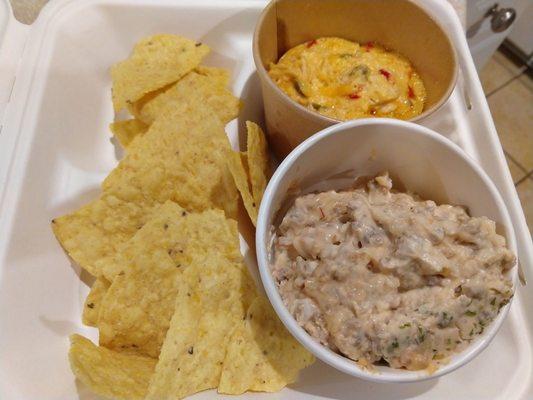 Takeout dips and chips from tonight's Gullah Garden lighting program- one is sausage dip and the other is chicken dip.