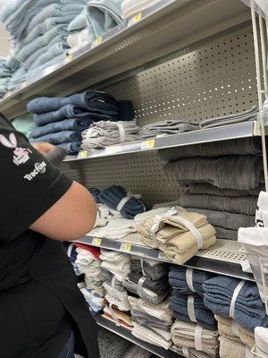 Manager arranging towels after she ordered me to leave the store.