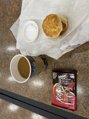 Last minute spicy chicken biscuit, some type of coffee, and Strawberry kit kats