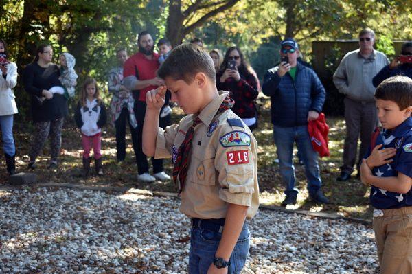 Boy Scouts participating in a flag retirement ceremony at the Post