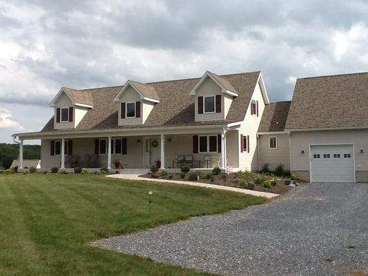 Pleasant Valley modular home with garage and front porch added.