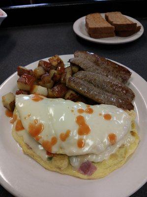 Western omelet with side of sausage.