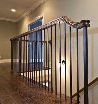 Flooring and railing options within a new construction home.