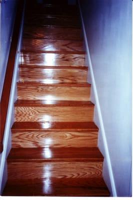 Old beat up pine risers painted white and covered with oak veneer