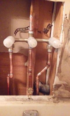 Removed an old three handle valve and installed a new three handle valve, due to the old one being broke.