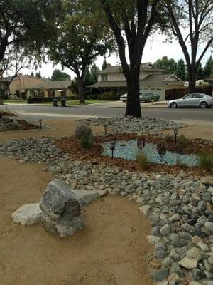 Job in Claremont - put in decomposed granite, California native plants, and a dry pond with recycled glass.