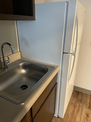 Full sized fridge and good size sink