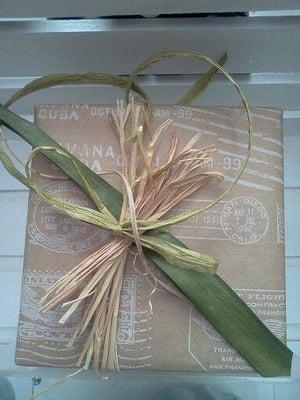 Brown-bagging lunch gift wrap with raffia and grass blades.  (Yes, he really gift wrapped her lunch.)