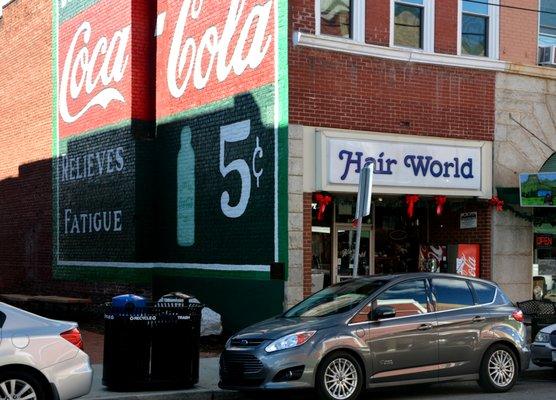 Love the sign on the side of building. Bet you can't get a coke for this price anymore