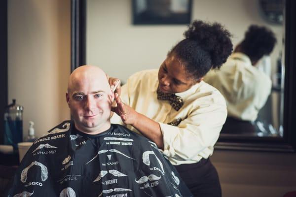 Joy giving a head straight razor head shave