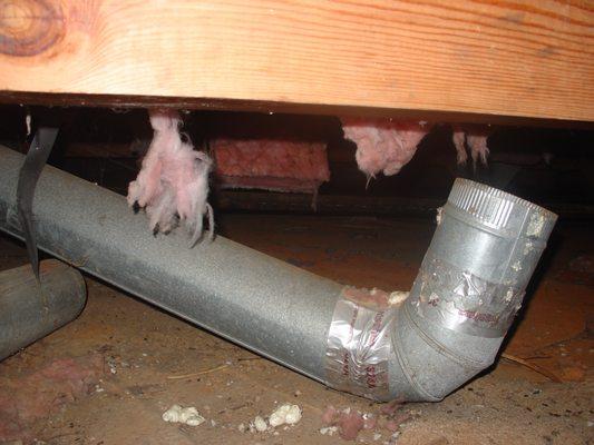 HVAC ducting that was disconnected in and drawing air from the crawlspace.