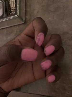 This is the nail polish job I was left with after the owner le got upset because I was telling him How I wanted my nails