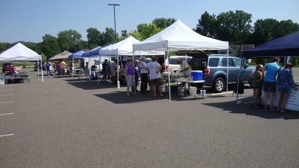 The vendors are located in the parking lot on the west side of the ice arena.