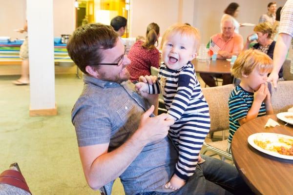 Family Meal every First Sunday. Pastor Chris and his youngest son.