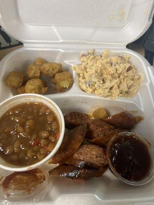 Dinner plate 1 meat 2 sides plus a side order.  Smoked sausage, potatoes salad, loaded baked beans and fried okra!