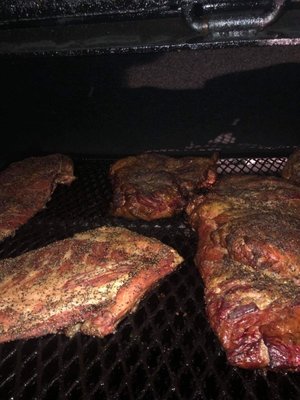 Meat smoking on the Smoker for our customers.