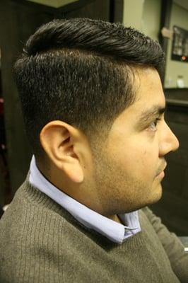 Comb over style with fade/tapered sides and natural beard line up.  Haircut by Rob.