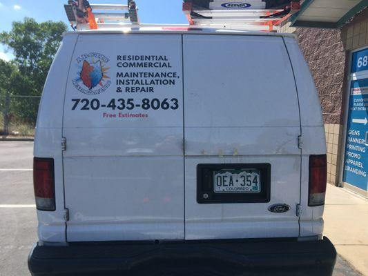 Simple full color logo installed on back of van.