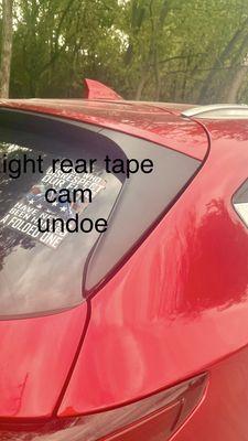 Hatchback with bad installed trim they used double sided tape to secure it UNBELIEVABLE