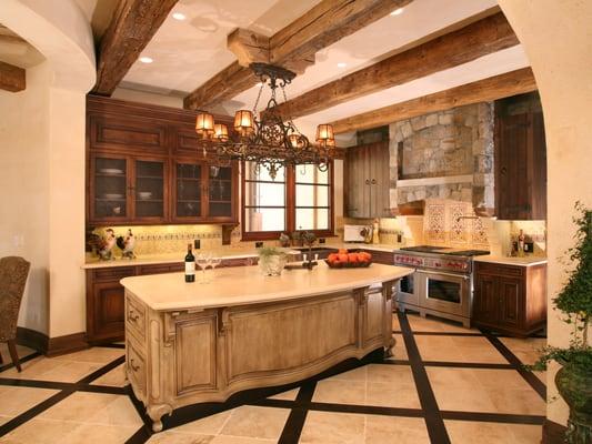 Custom Kitchen Design with Mediterranean and Tuscan influence. Lighting by Fine Art Lamps.  Interior Design by Martin Perri Interiors.