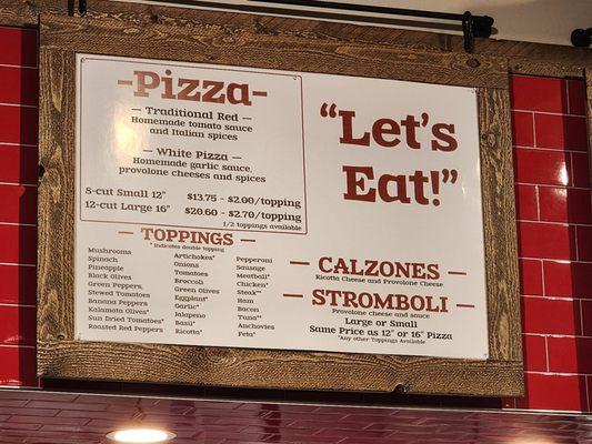 Pizza Menu above counter.