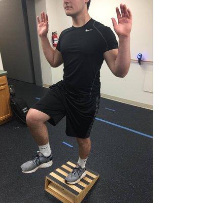 Patient utilizing the Slant Board to test his balance