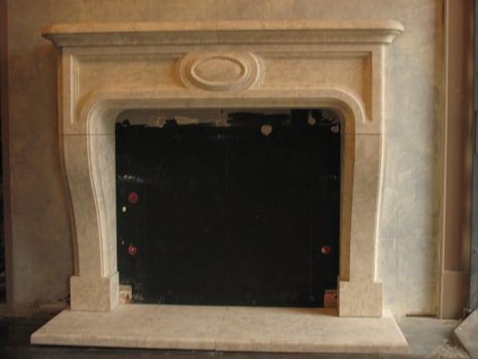 Hand carved limestone fireplace mantle