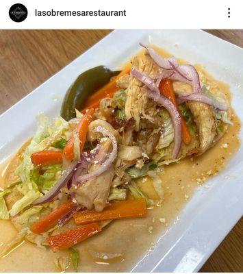 Chicken on a hard shell tortilla, with beans and veggies, better known as gorditas de pollo. Served only on the weekends.