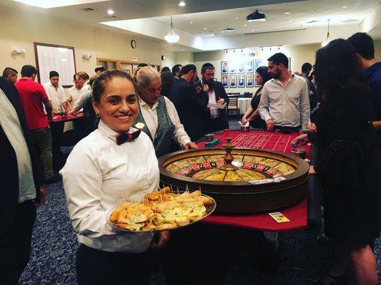 Ivonne serving appetizers for casino night!