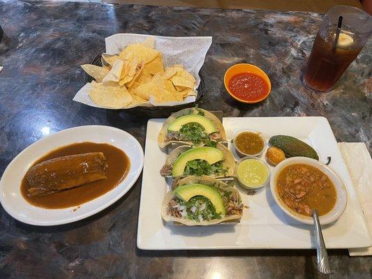 Tamale and soft corn tortilla carnita tacos.