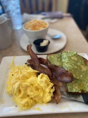 Eggs, bacon (ordered well done) avocado toast, grits with cheese, coffee.