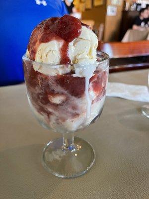 Strawberries Maria-a summer dessert of house prepared simmered strawberries in rum and brown sugar between layers of ice cream!