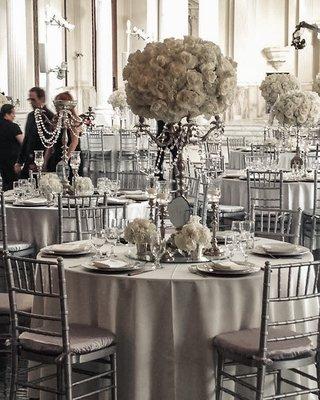 Silver Chiavari Chair paired with tones of satin silver and white in the table setting